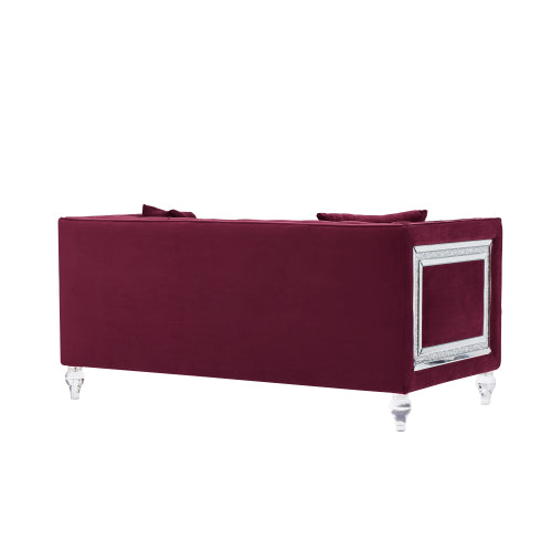 Two-seater red velvet sofa