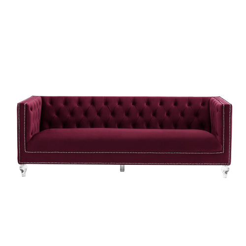 Three-seater red velvet sofa