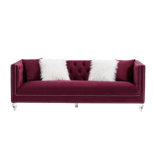 Three-seater red velvet sofa