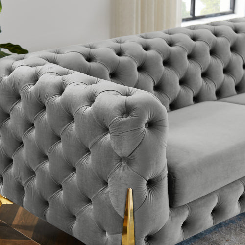 Two-seater grey velvet sofa