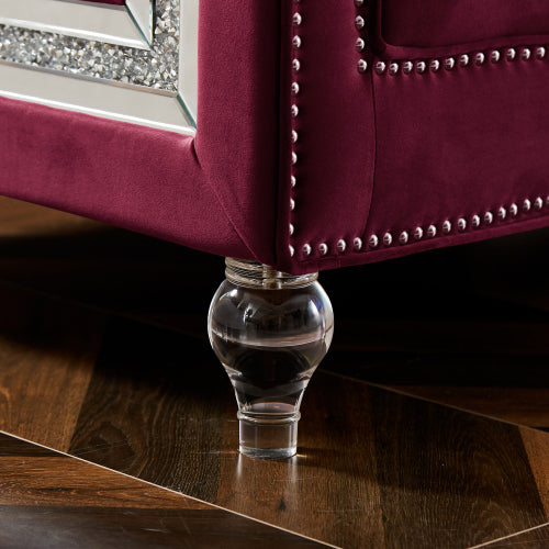 Three-seater red velvet sofa