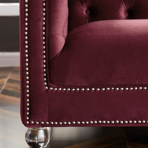 Two-seater red velvet sofa